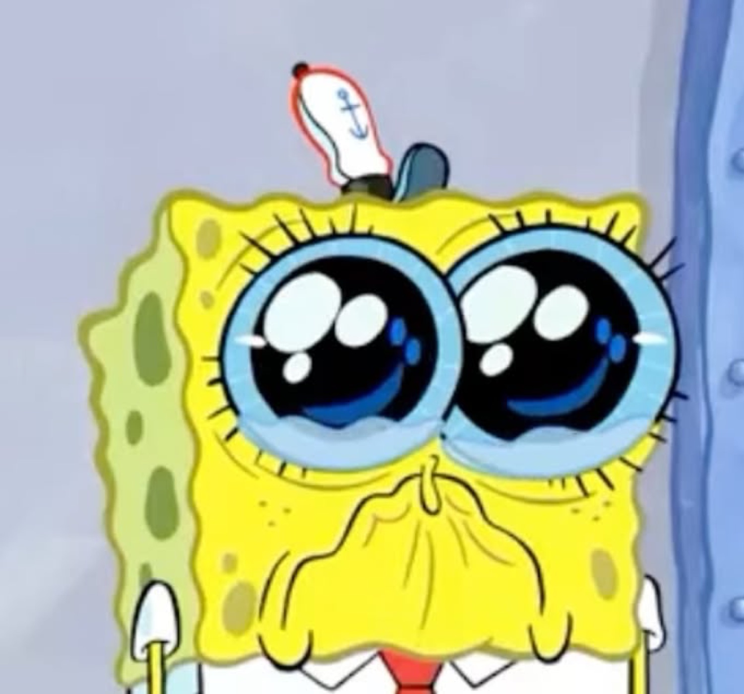 SpongeBob with huge teary eyes and a quivering pout, about to cry