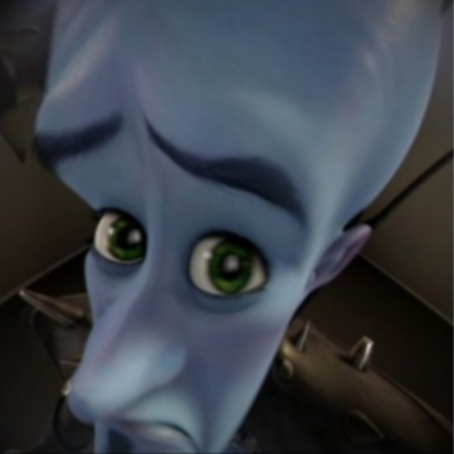 Megamind staring up with wide anxious eyes, looking deeply worried
