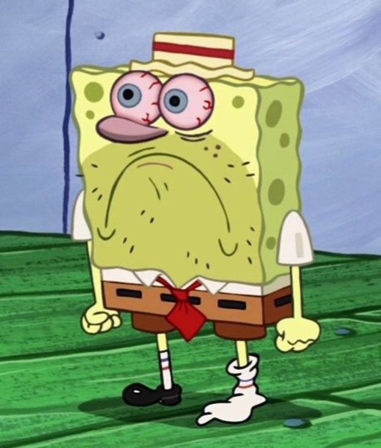SpongeBob standing there with bloodshot bulging eyes and a completely deflated face