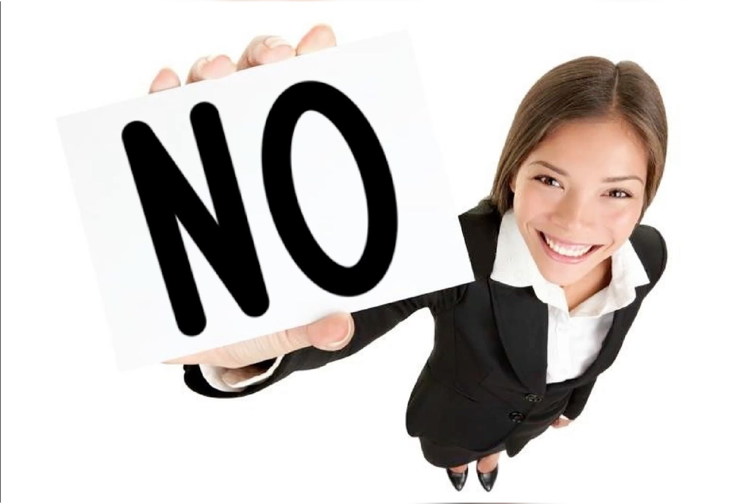 Smiling woman holding a big 'NO' sign