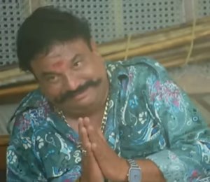 Mustached man pressing his palms together, pleading