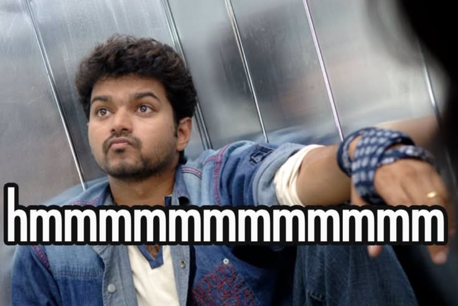 Vijay leaning back with a skeptical look: 'hmmmmmmmmmmmm'