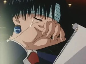 Anime character silently crying while covering their face with a paper