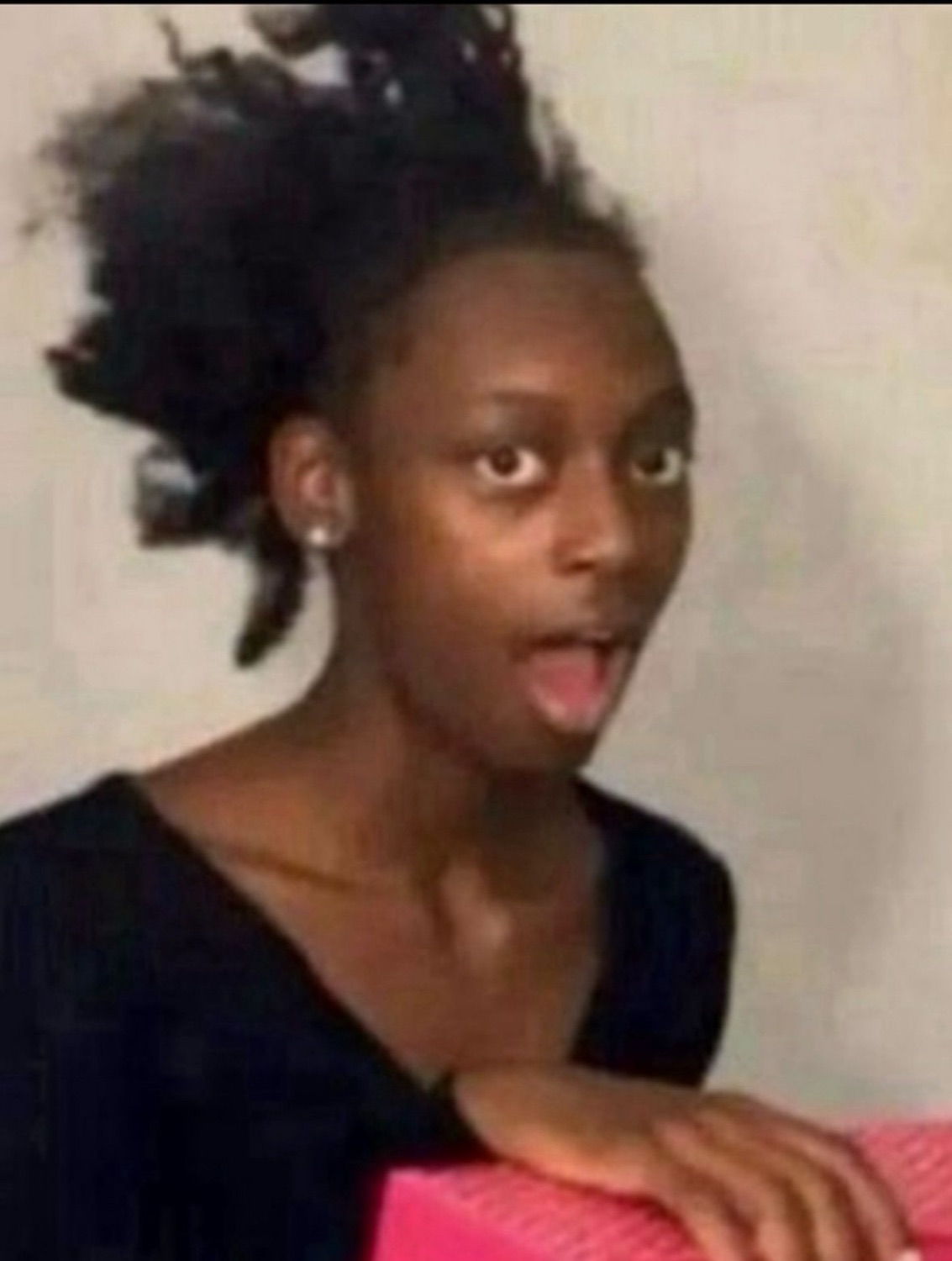 Young woman with wide eyes and her mouth open in stunned surprise