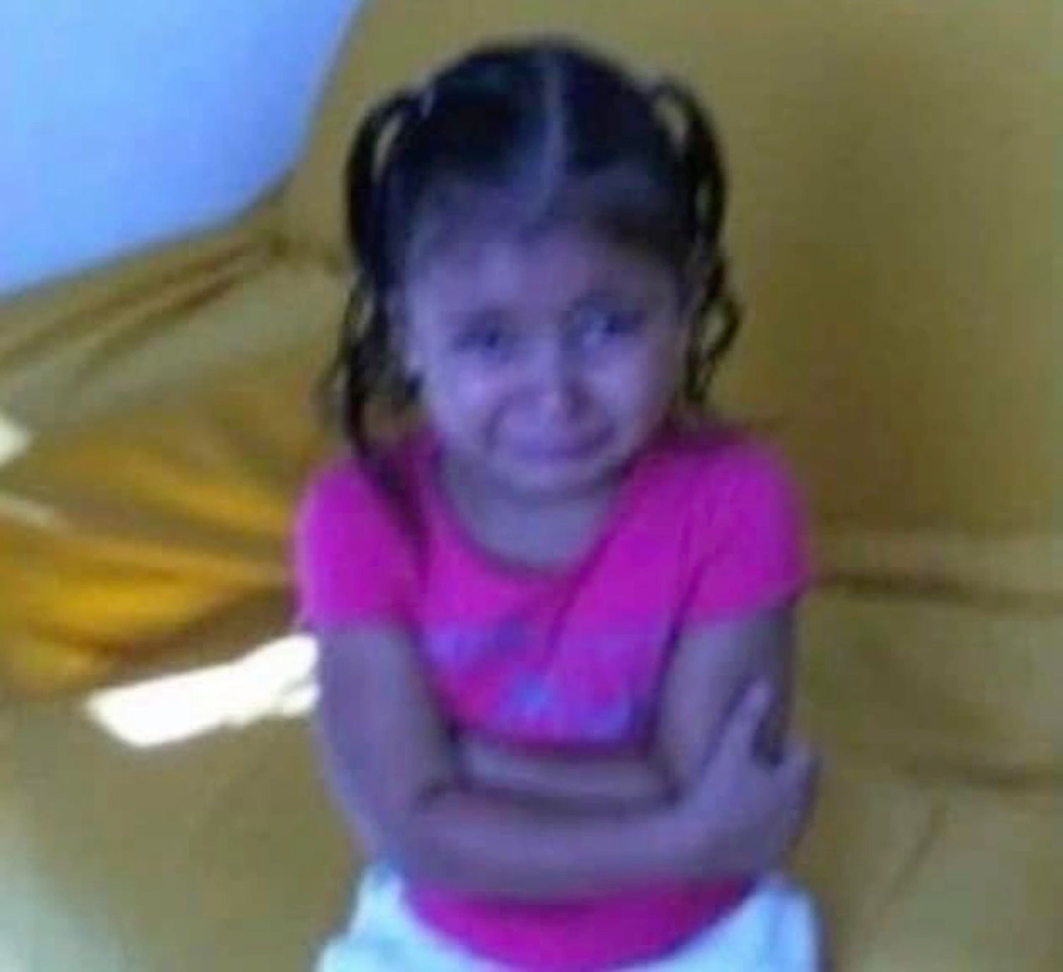 Little girl in a pink shirt with arms crossed crying and pouting with full attitude
