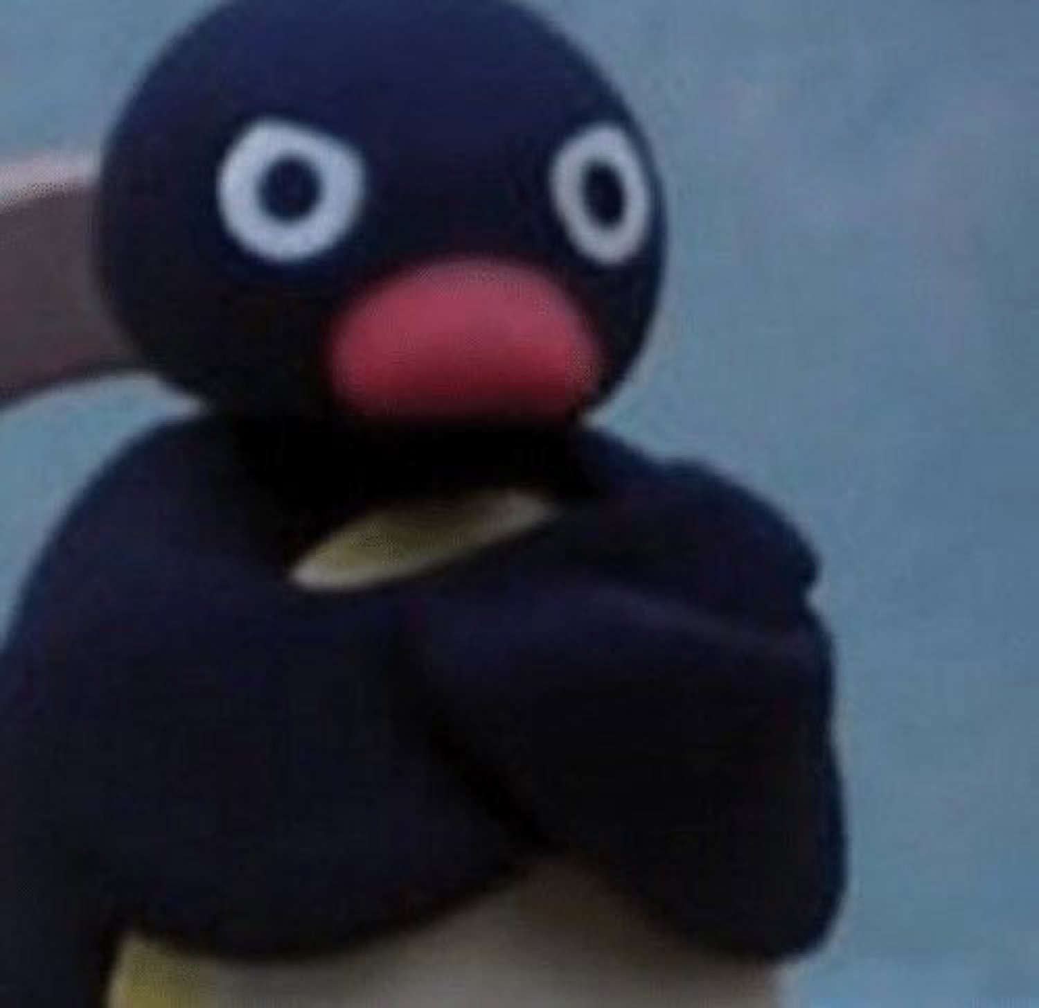 Pingu with his arms crossed, glaring and unimpressed