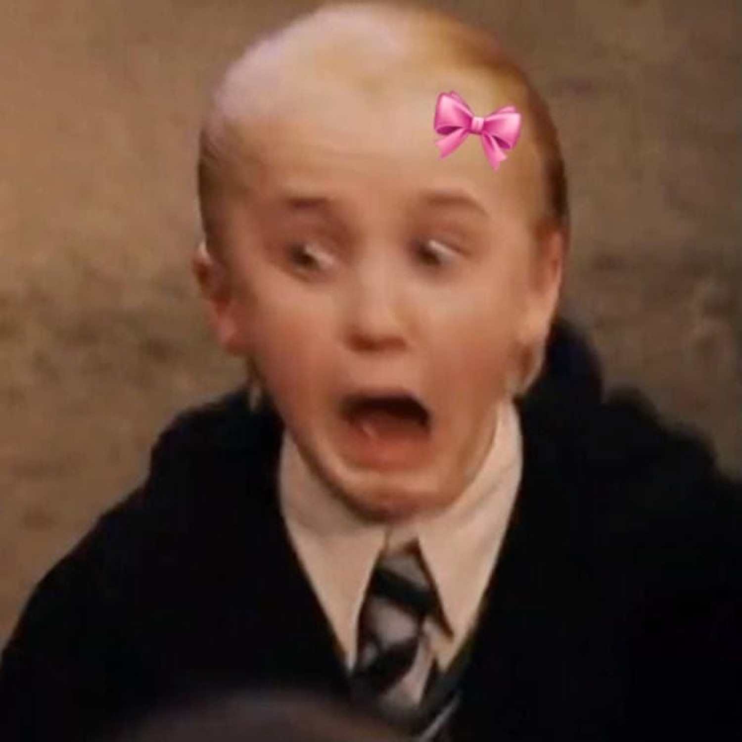 Young Draco Malfoy with a pink bow, gasping in shock
