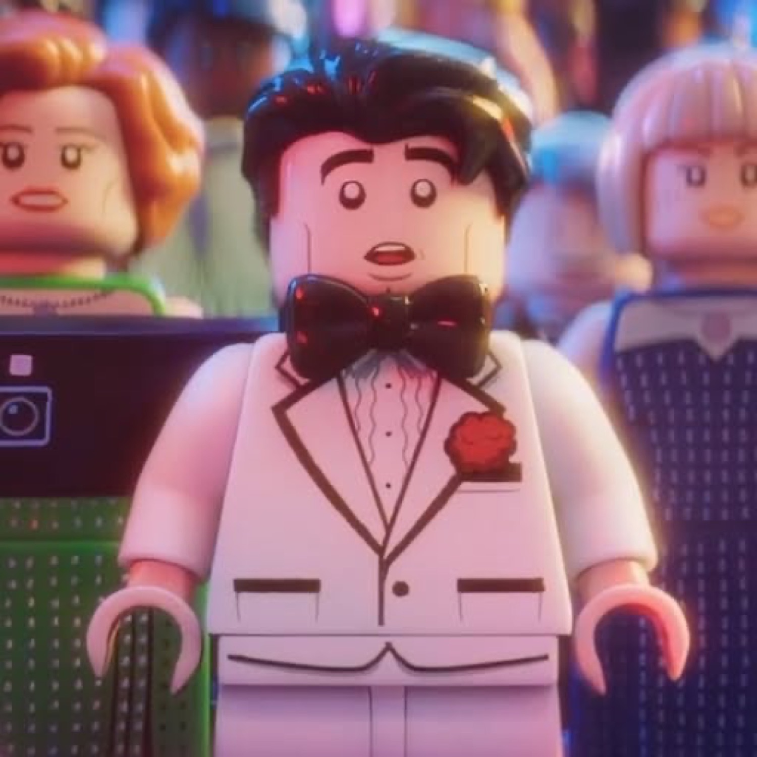 LEGO man in a white tuxedo standing frozen with a wide-eyed, mouth-open shocked look