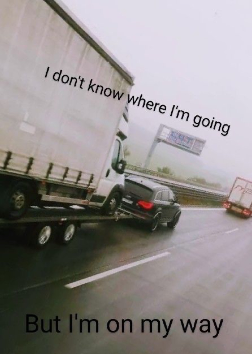 Truck towing a car: 'I don't know where I'm going / But I'm on my way'