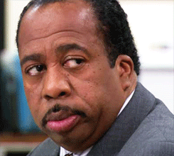 Stanley Hudson from The Office glancing sideways with maximum done energy