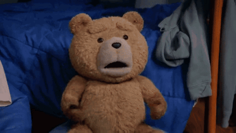 Teddy bear running away across a rug
