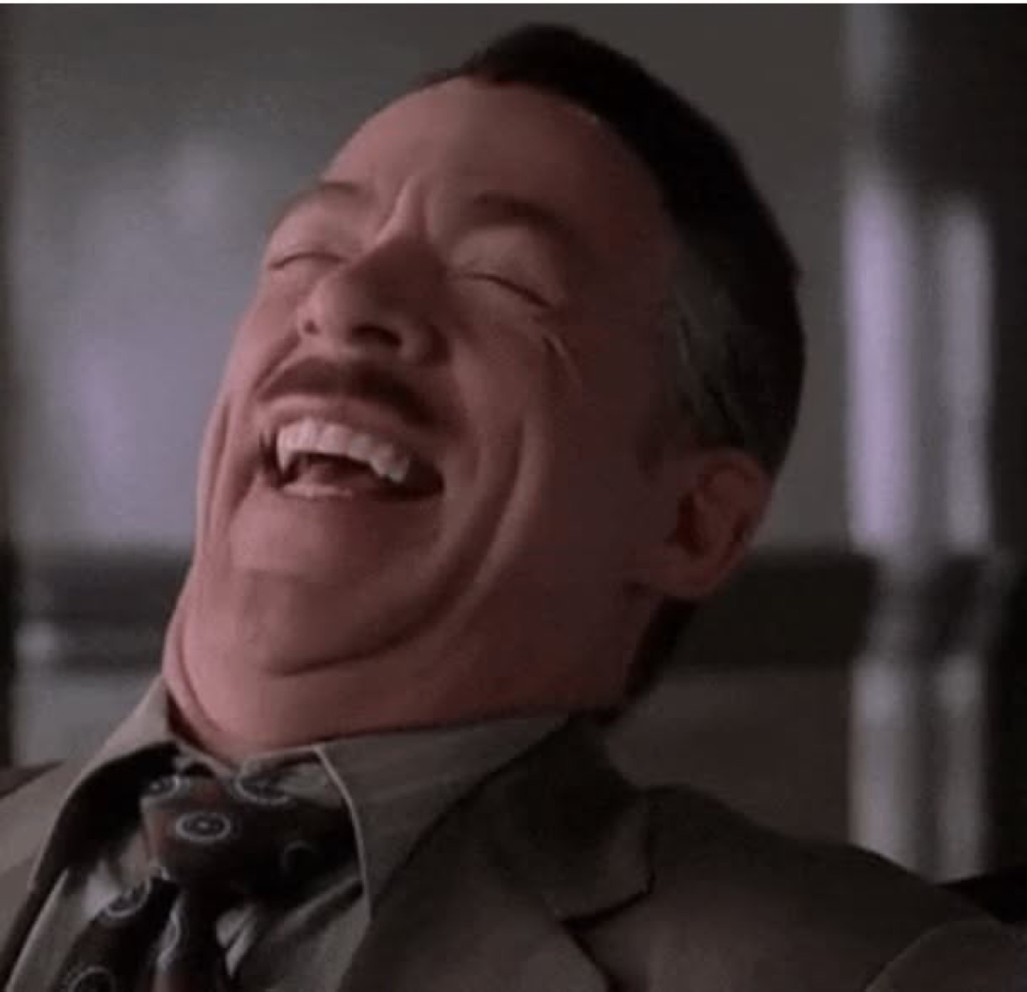 J. Jonah Jameson throwing his head back in a full belly laugh at your misfortune
