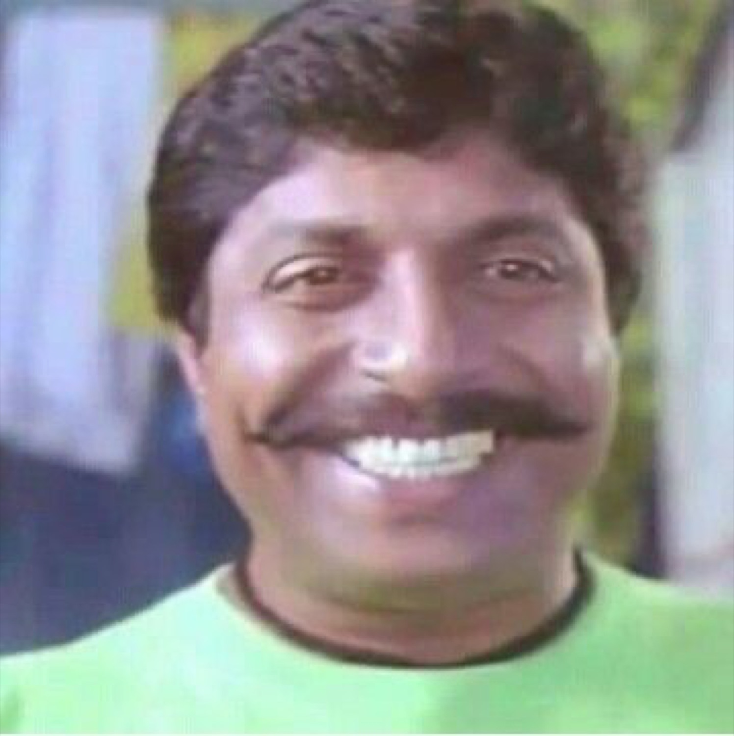 Sreenivasan with a huge toothy grin