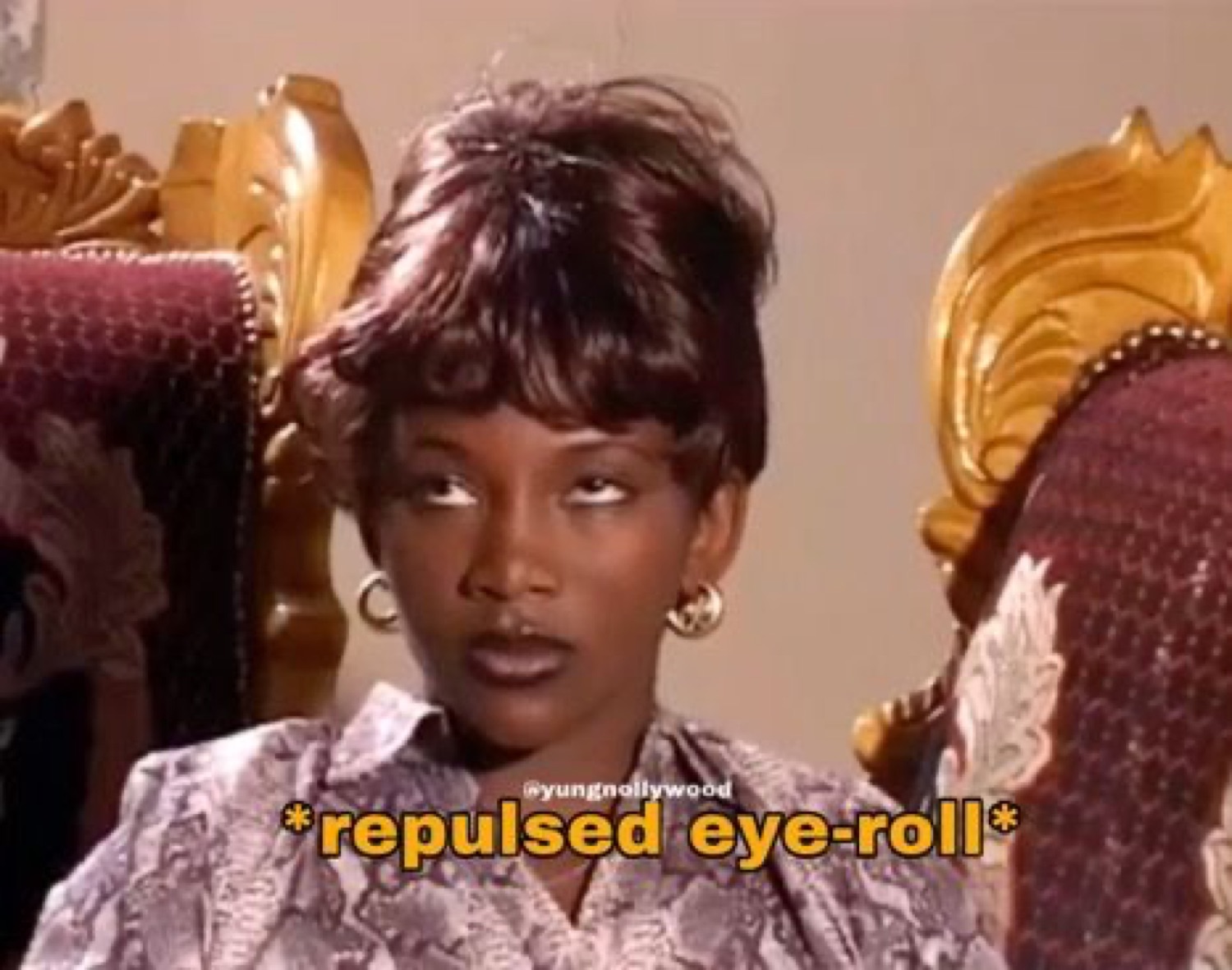 Woman on an ornate chair rolling her eyes in disgust captioned '*repulsed eye-roll*'