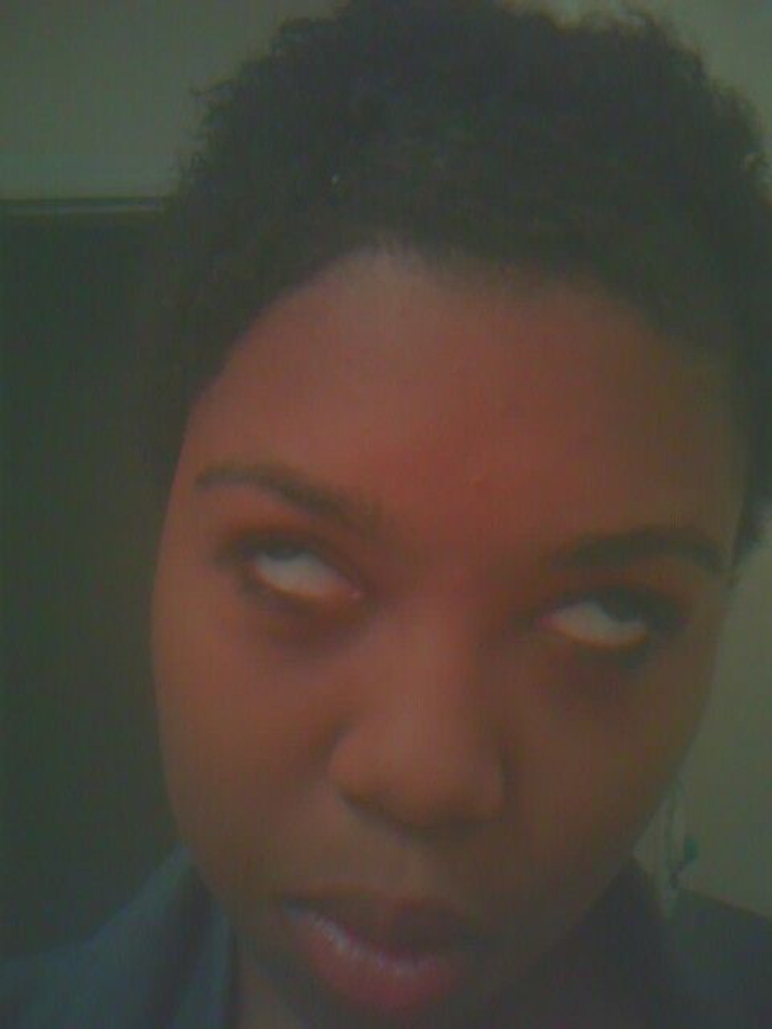 Person giving an extreme side-eye with whites of eyes fully showing, maximum judgment energy