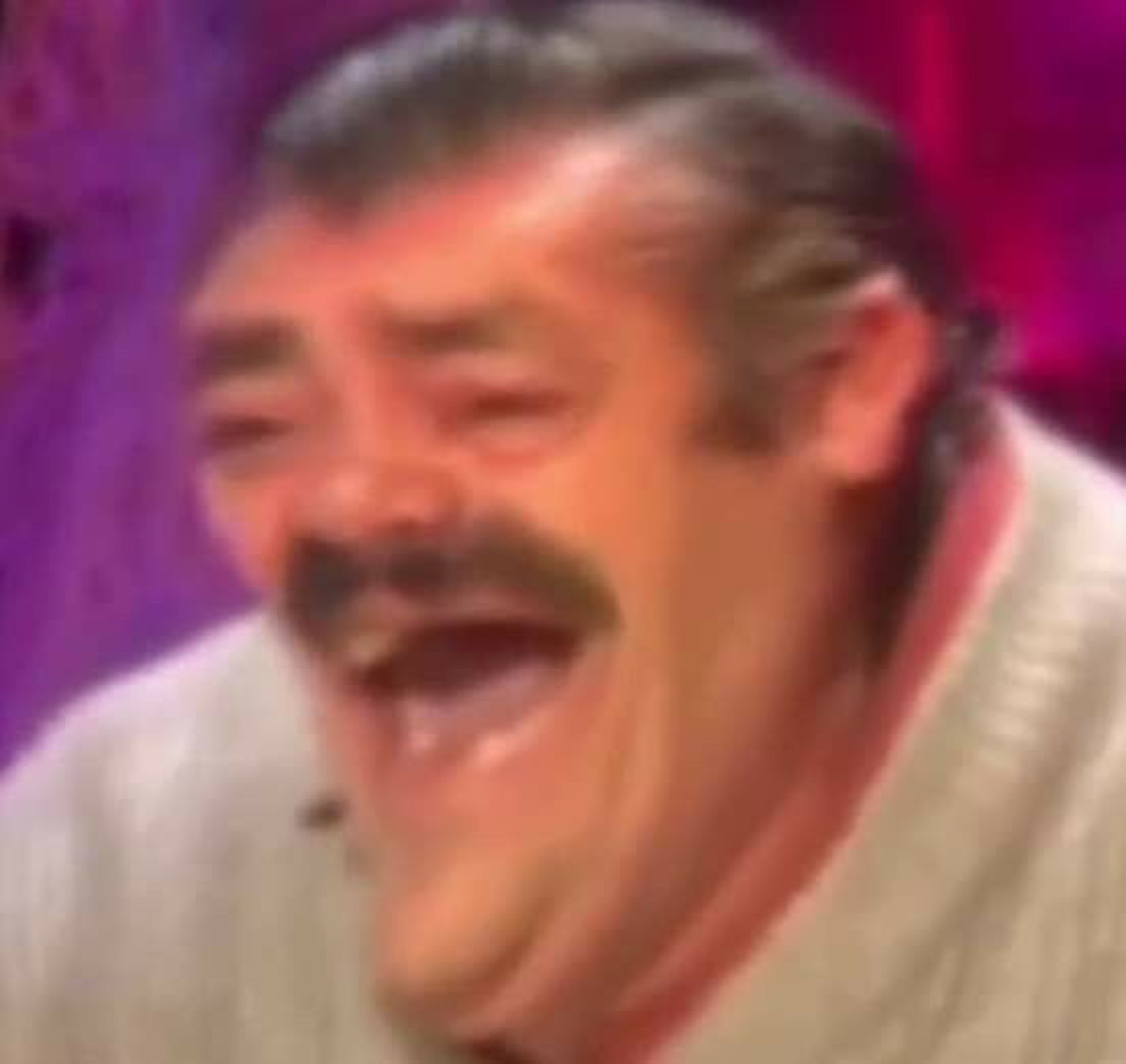 Mustached man throwing his head back cackling with his mouth wide open