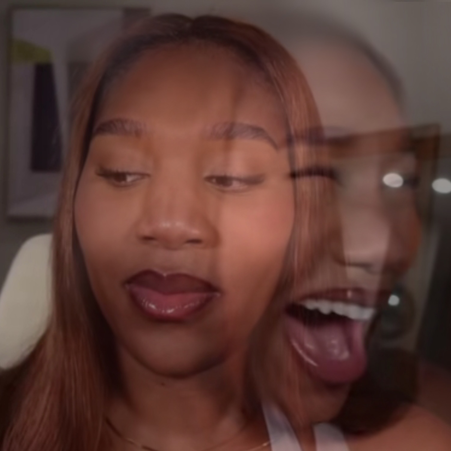 Double-exposure selfie of a woman — serene face in front, wild tongue-out face ghosted behind