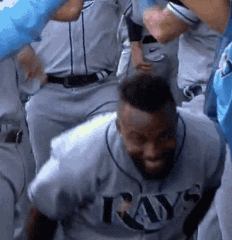 Tampa Bay Rays player dancing and celebrating in the dugout