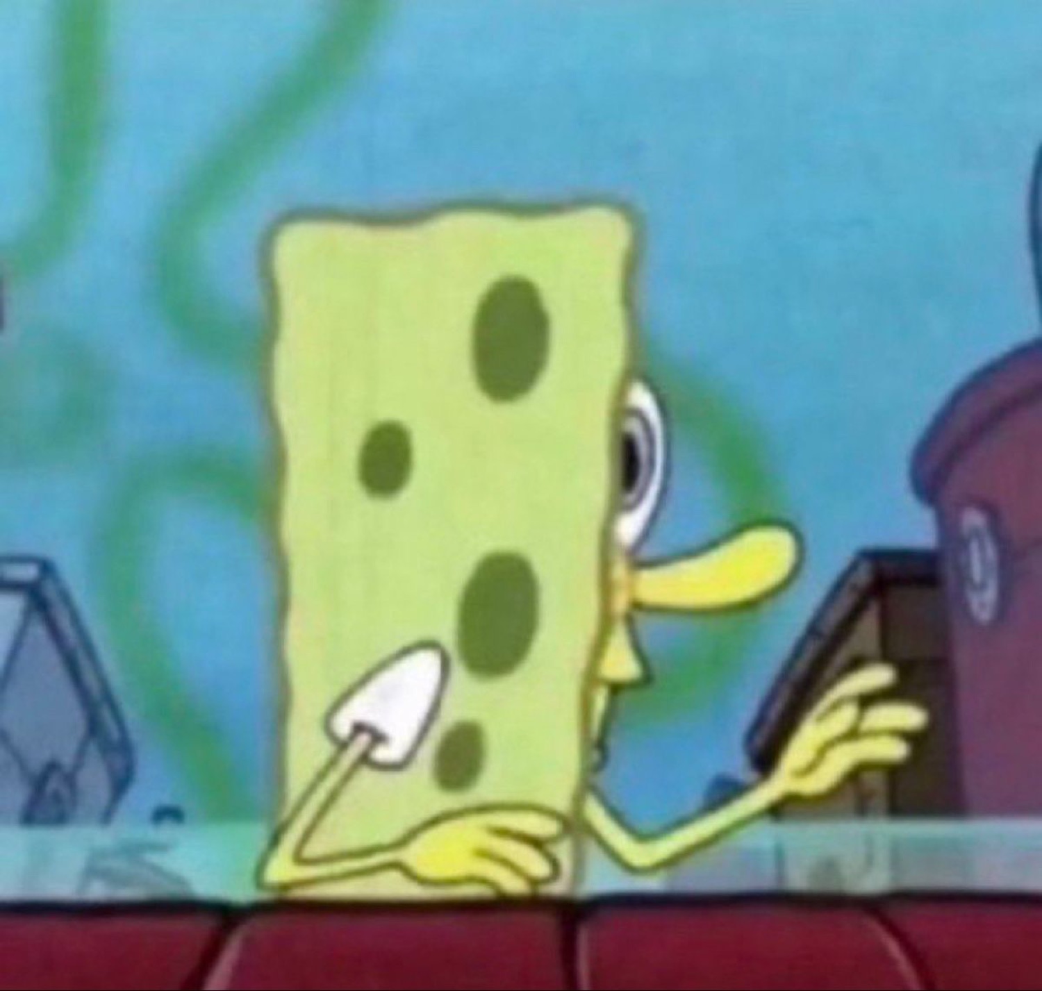 SpongeBob slumped at a counter with a flat, bored, done-with-it stare