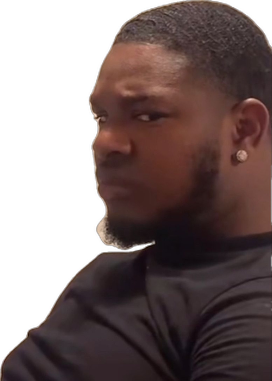 Cutout of a man in black glancing back with a suspicious side-eye