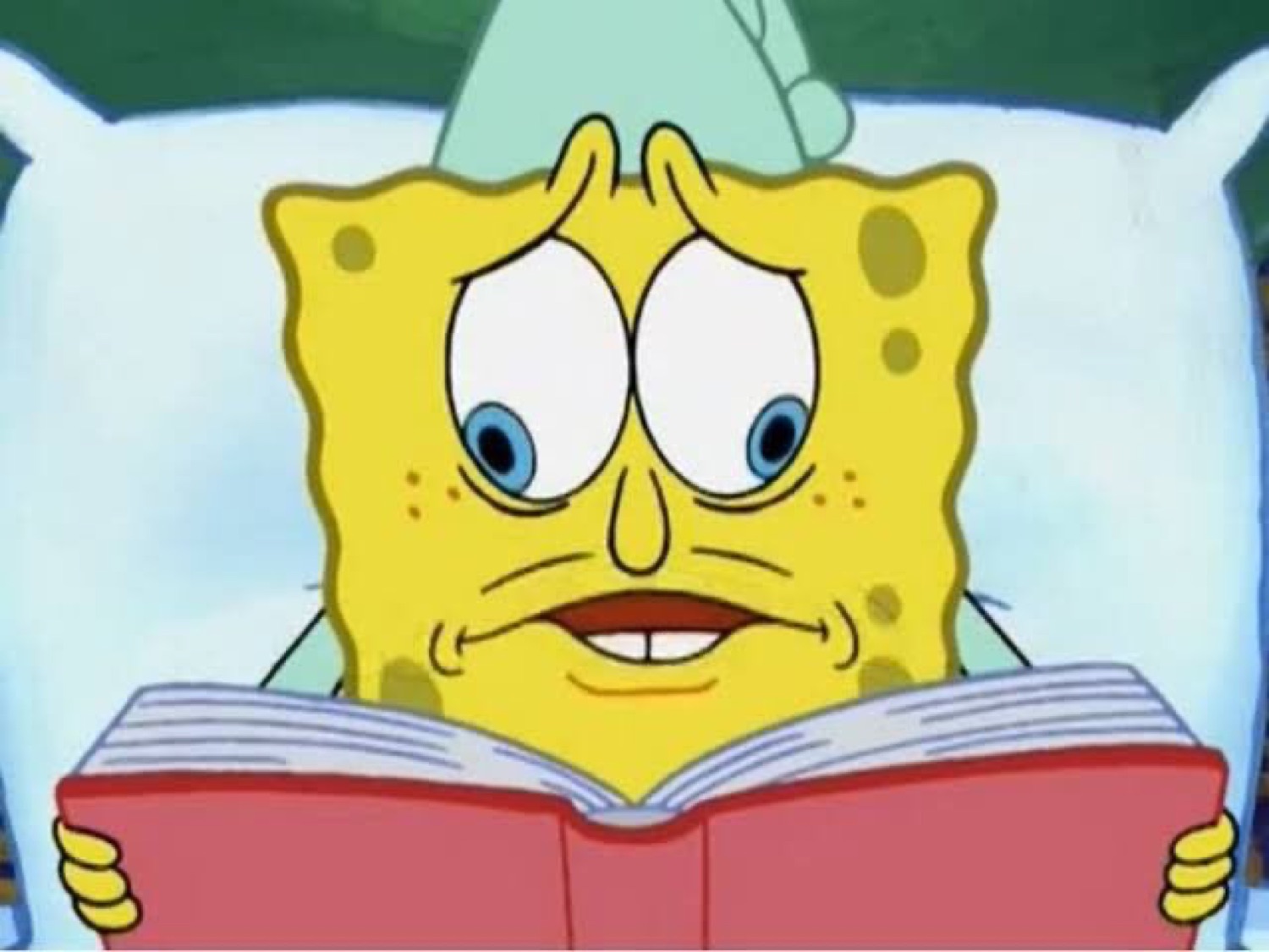 SpongeBob in bed reading a book with a nervous, worried face