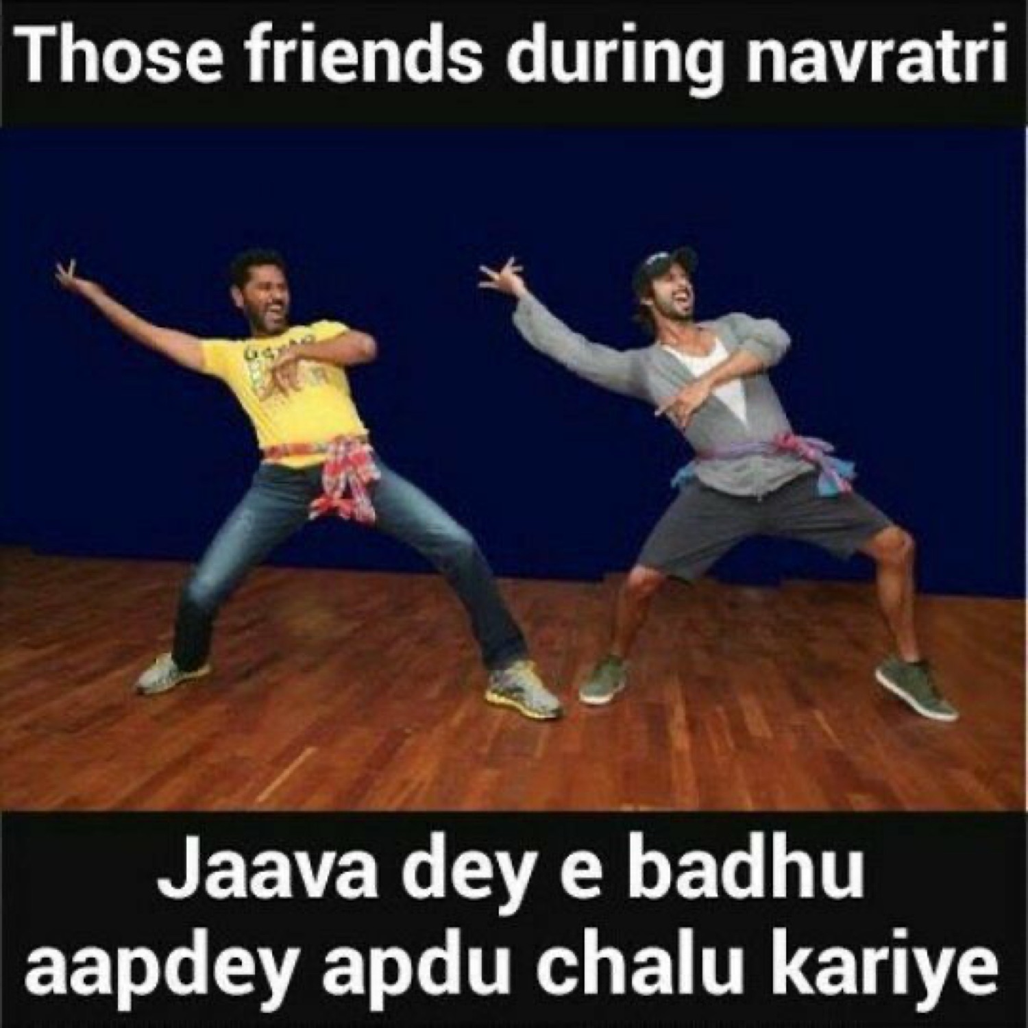 Two guys dancing on stage: 'Those friends during navratri / Jaava dey e badhu aapdey apdu chalu kariye' (forget all that, let's just start ours)