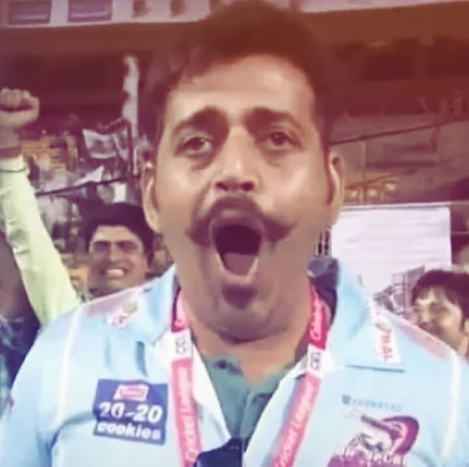 Ravi Kishan shouting with his mouth wide open in a stadium