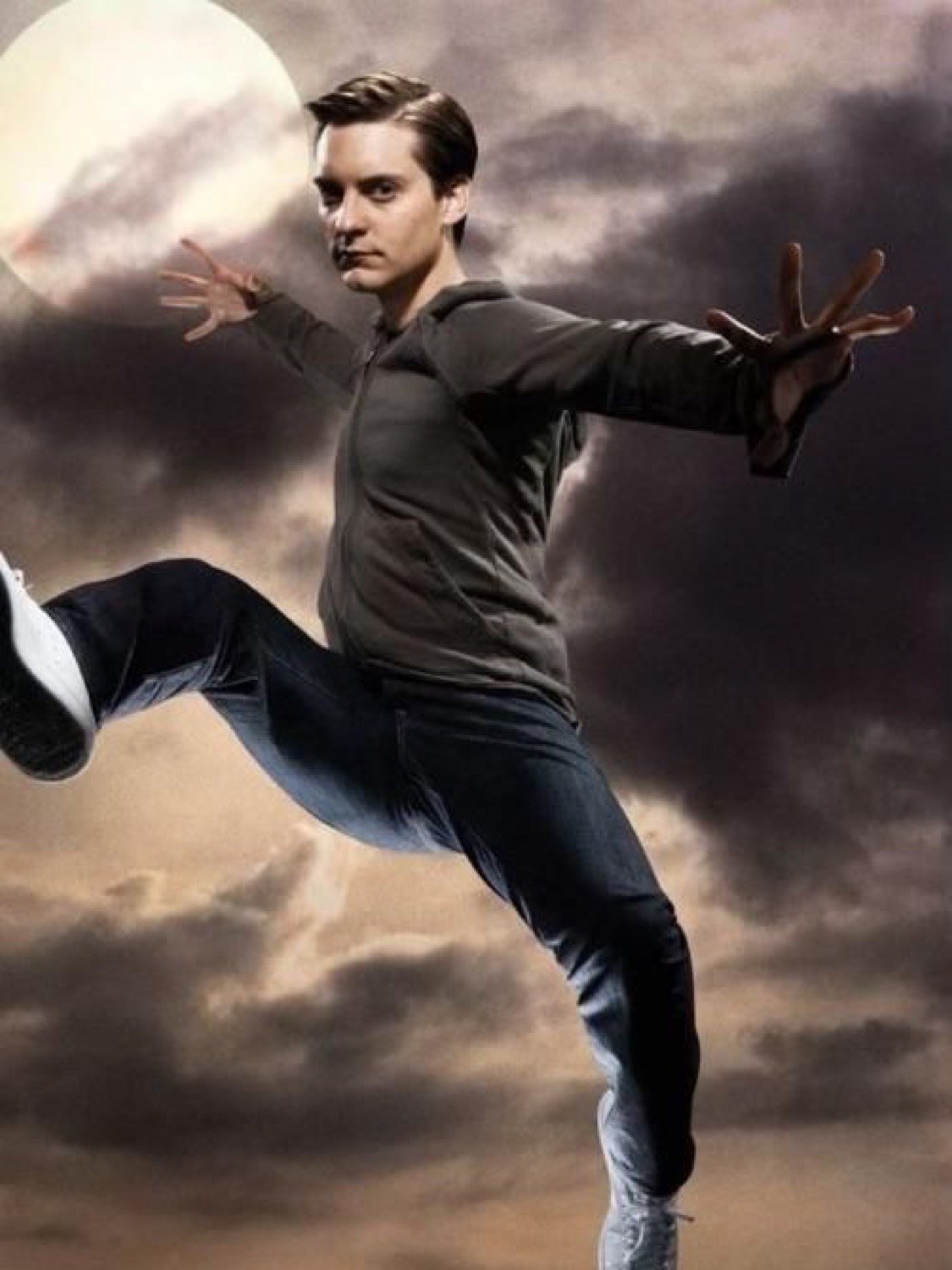 Bully Maguire striking a dramatic raised-leg pose against a moonlit sky