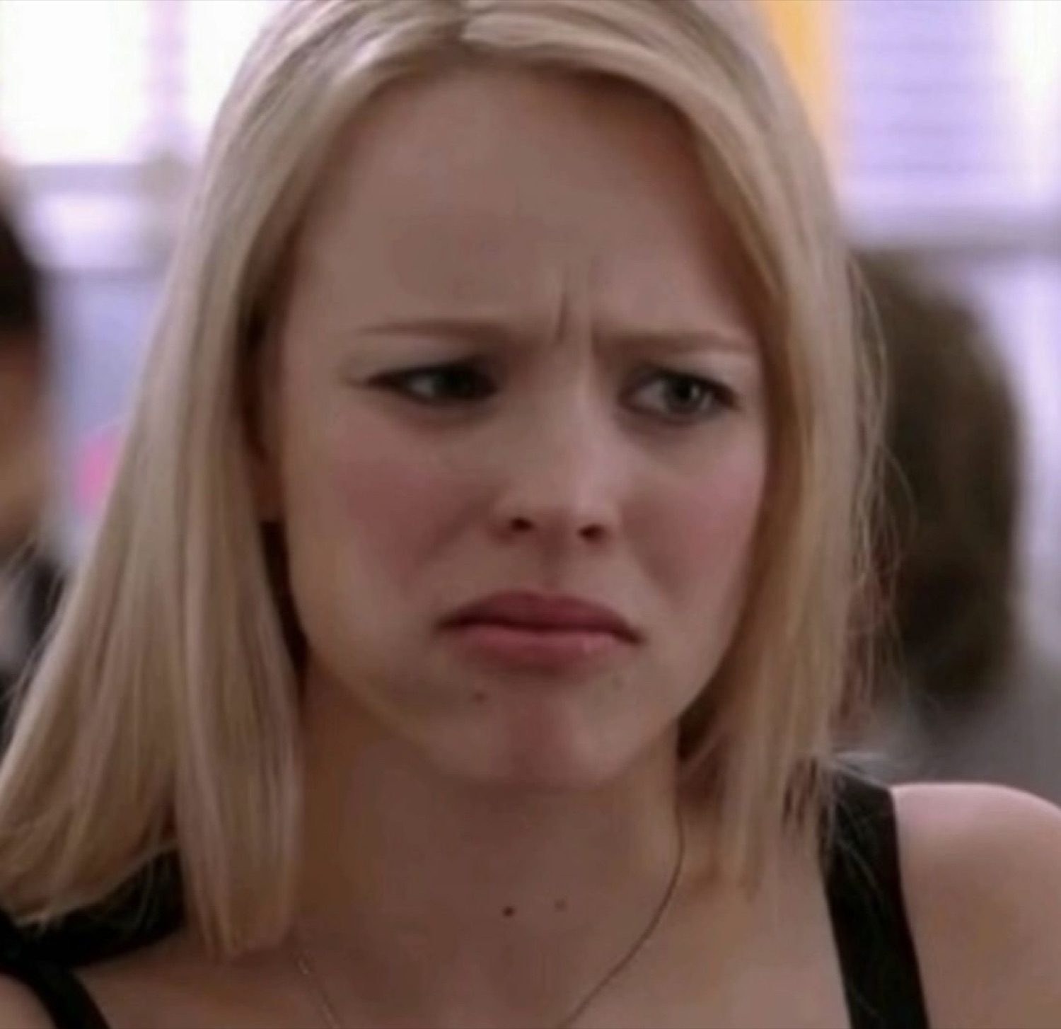 Regina George with furrowed brows and a quivering lip, visibly not impressed