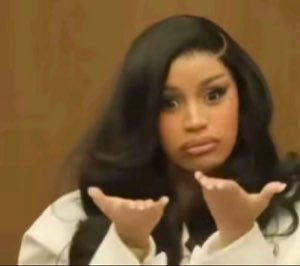 Cardi B holding both palms up in courtroom with a baffled, what-do-you-want look
