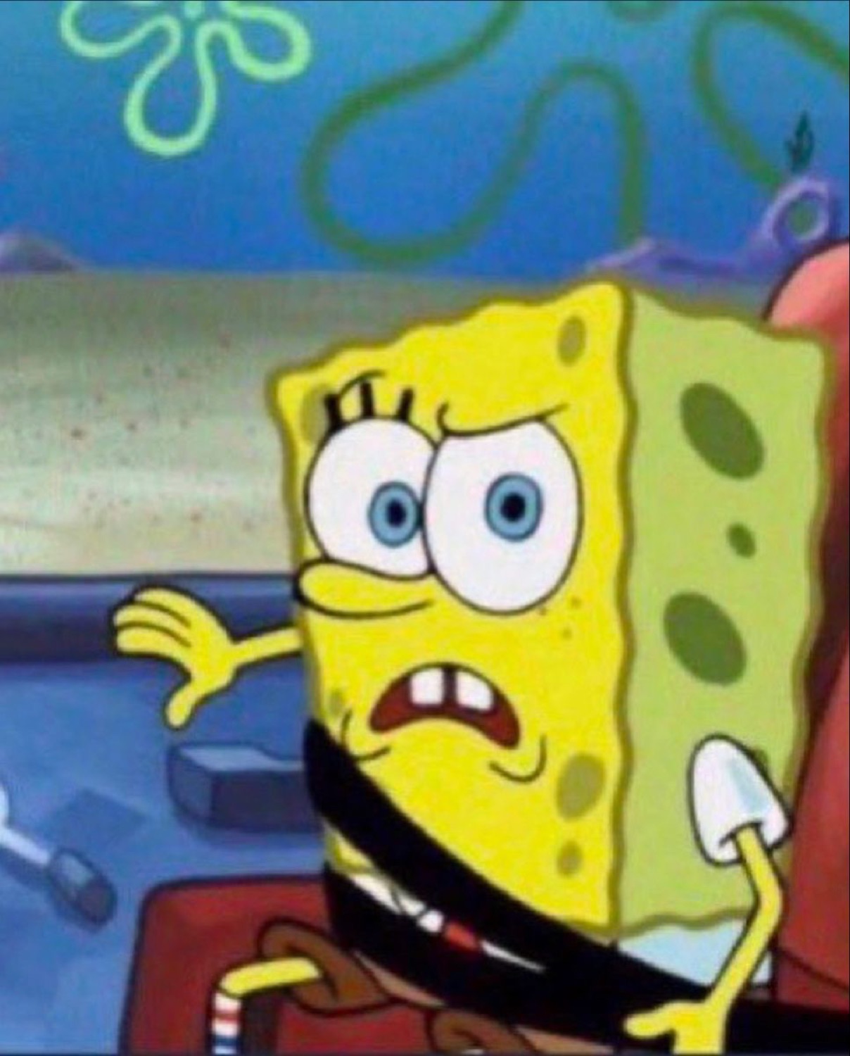 SpongeBob wincing in nervous alarm, reaching out with a worried grimace