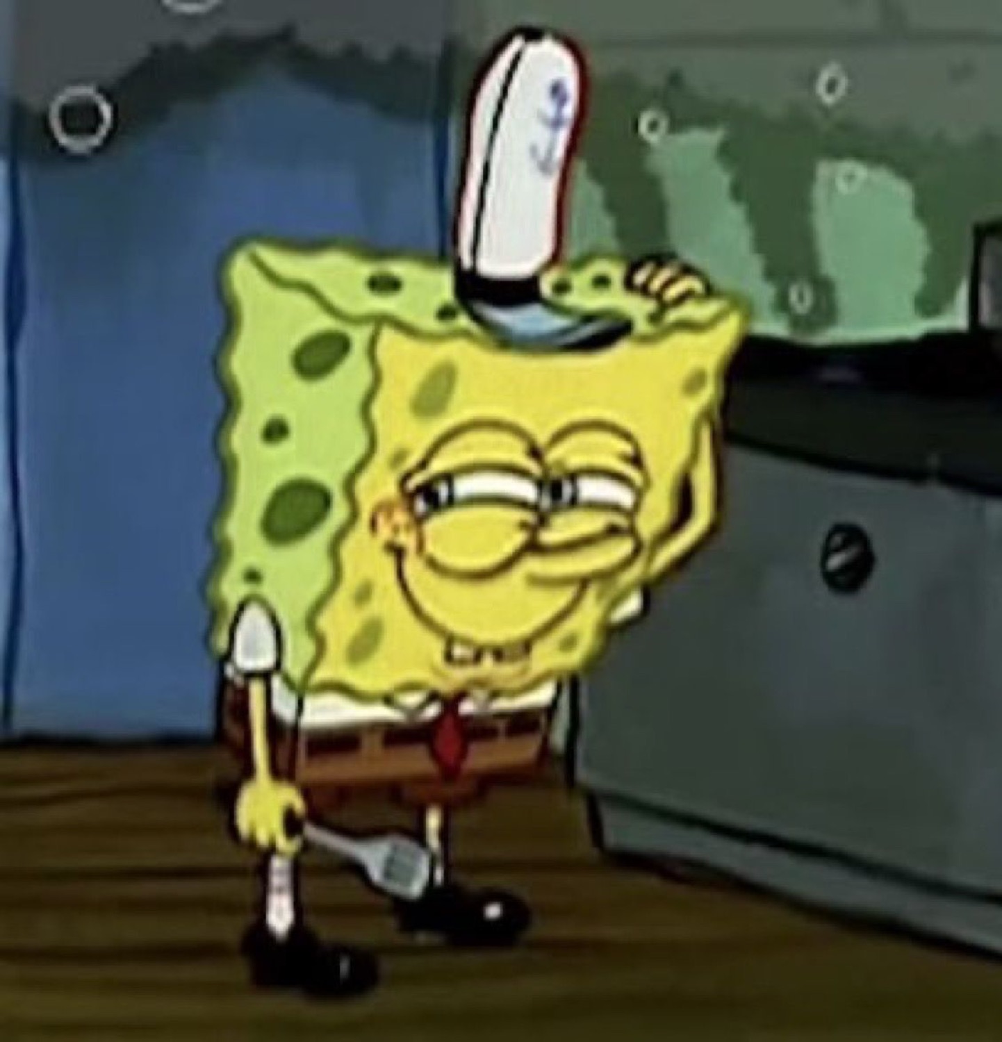 SpongeBob doing a sly squinting smirk with a spatula tucked overhead