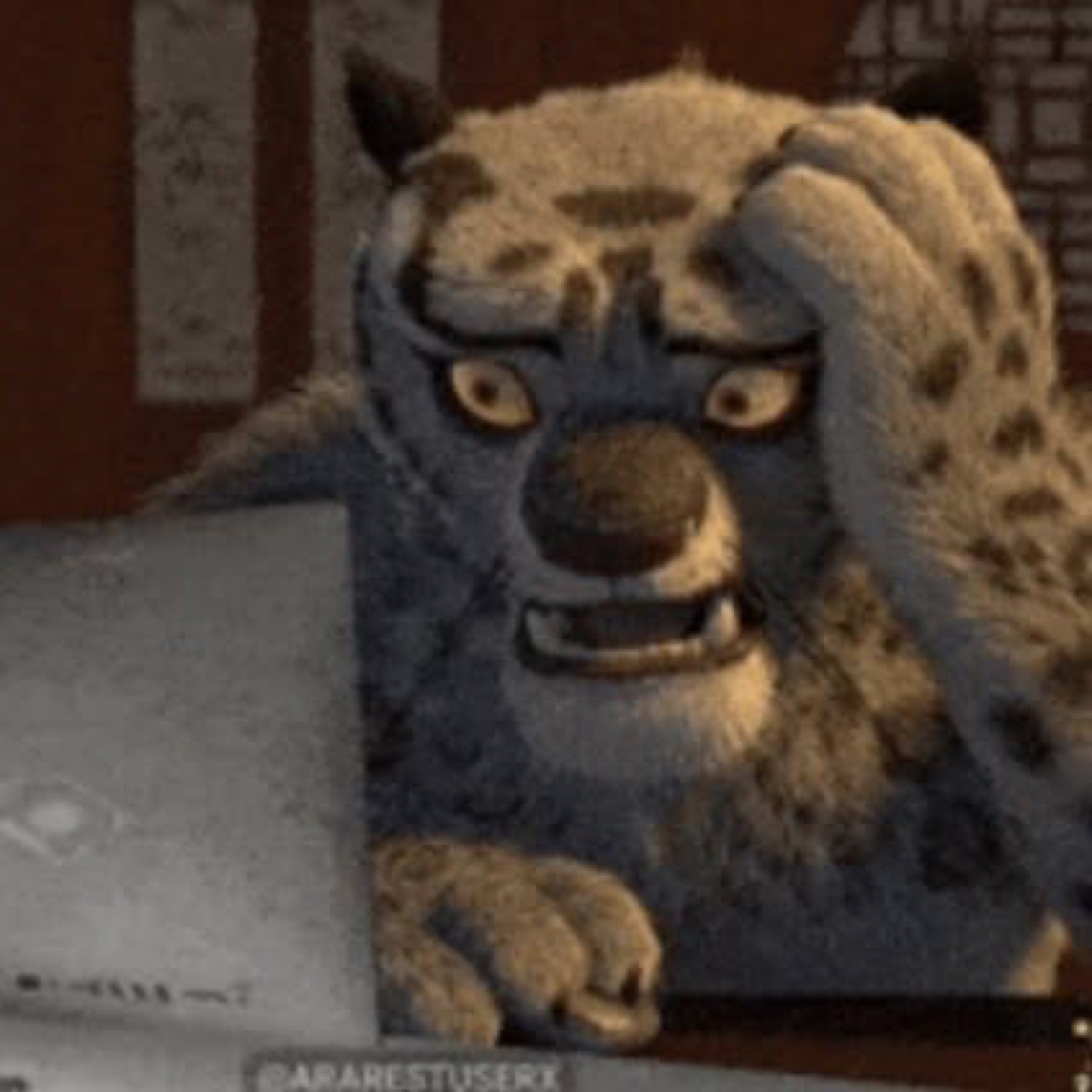 Tai Lung from Kung Fu Panda glaring intensely over a laptop with barely-contained fury