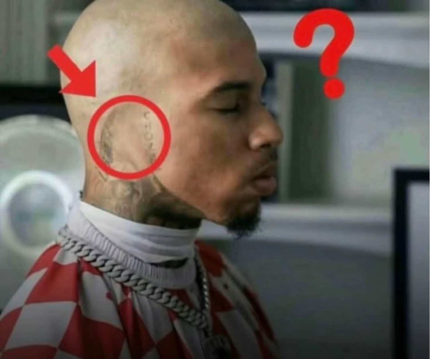 Bald tattooed guy in profile with a red circle and question mark on his neck ink
