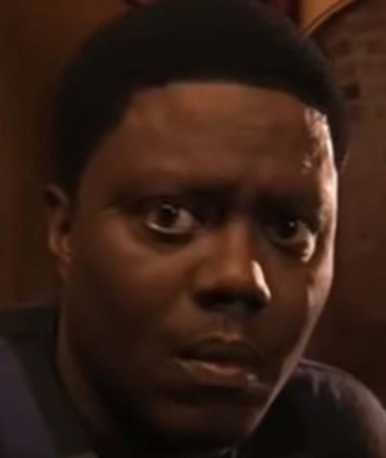 Bernie Mac staring wide-eyed and unsettled
