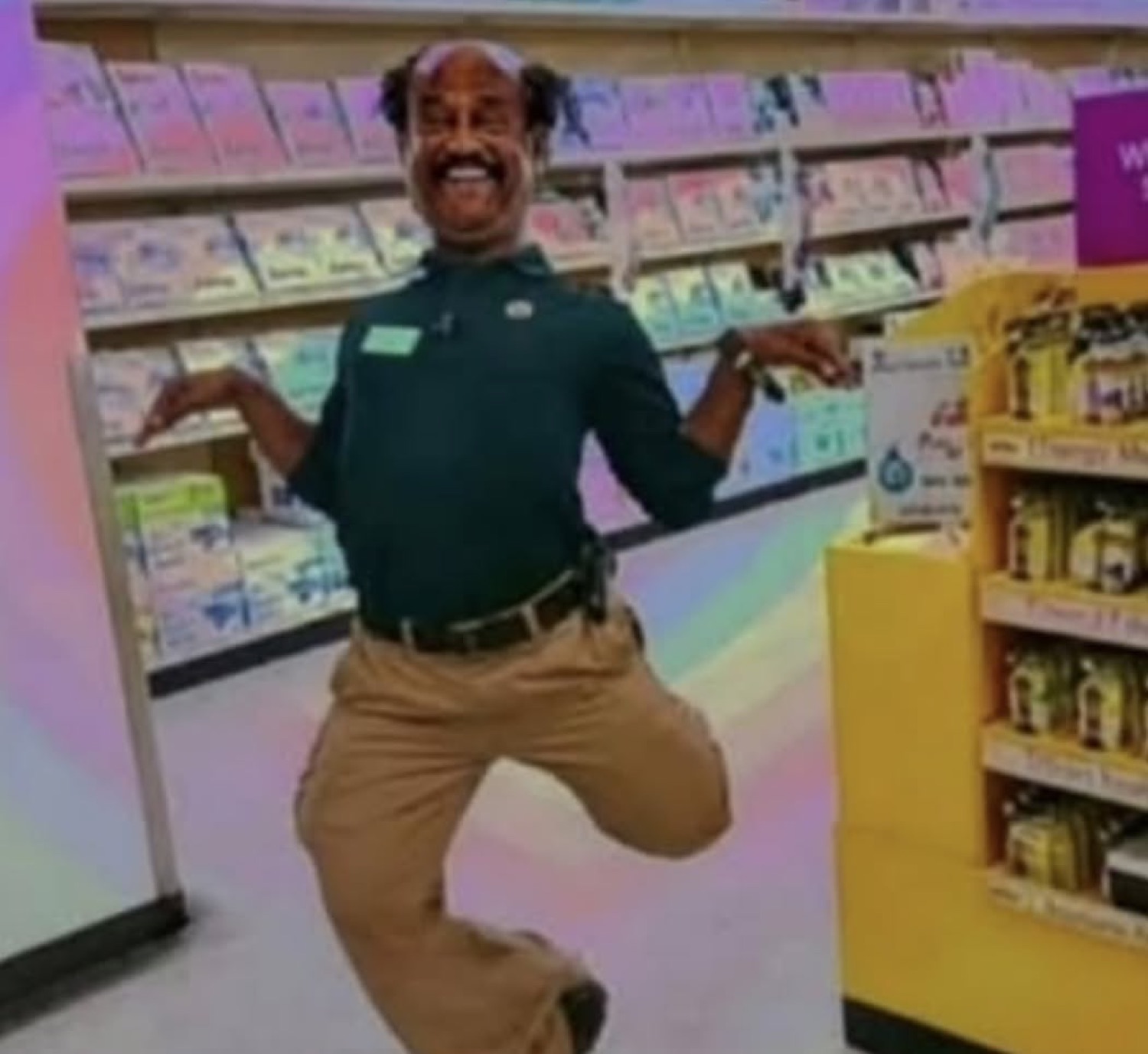 Rajinikanth striking a silly dance pose in a shop