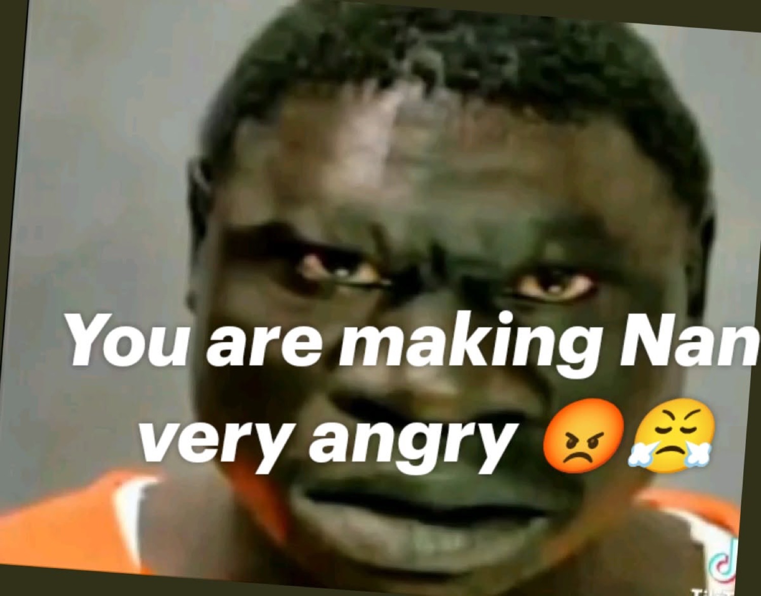 Man glaring angrily under 'You are making Nan very angry 😡😤'
