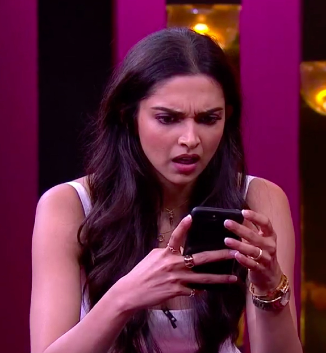 Deepika Padukone staring at her phone in confused disgust