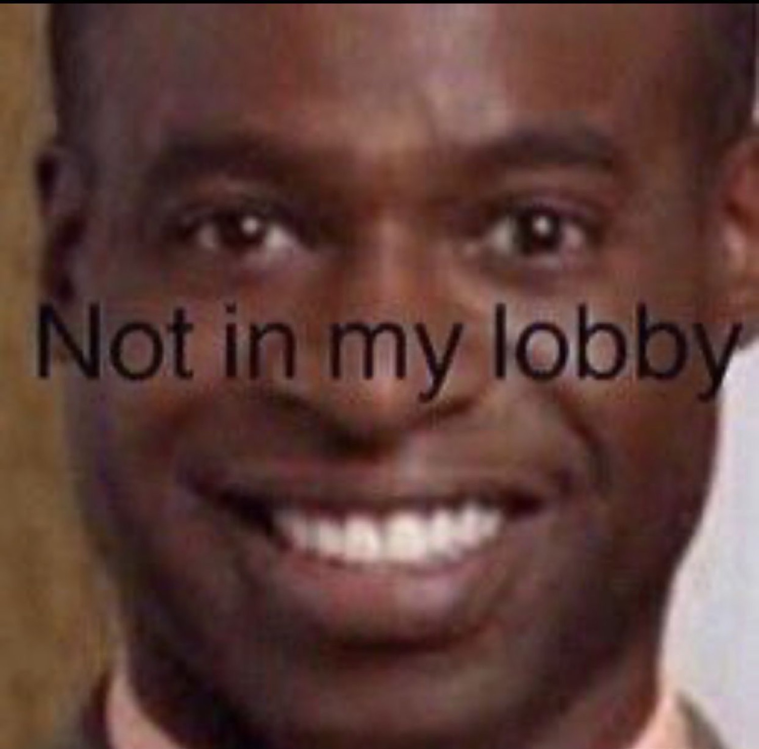 Grinning man with a smug knowing smile captioned 'Not in my lobby'