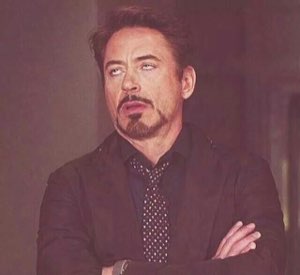 Robert Downey Jr. with arms crossed rolling his eyes in classic disdain