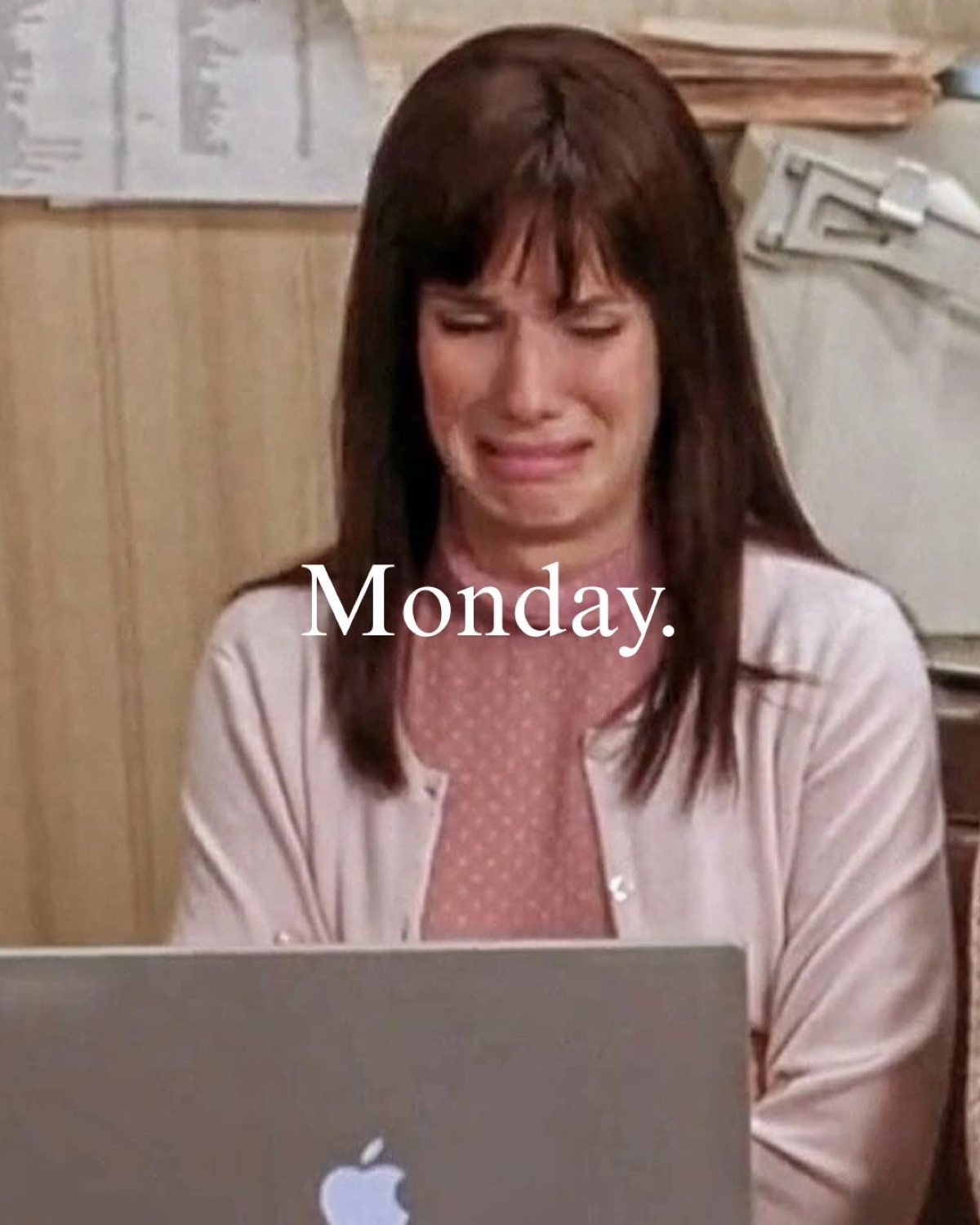Sandra Bullock crying at a laptop, captioned 'Monday.'