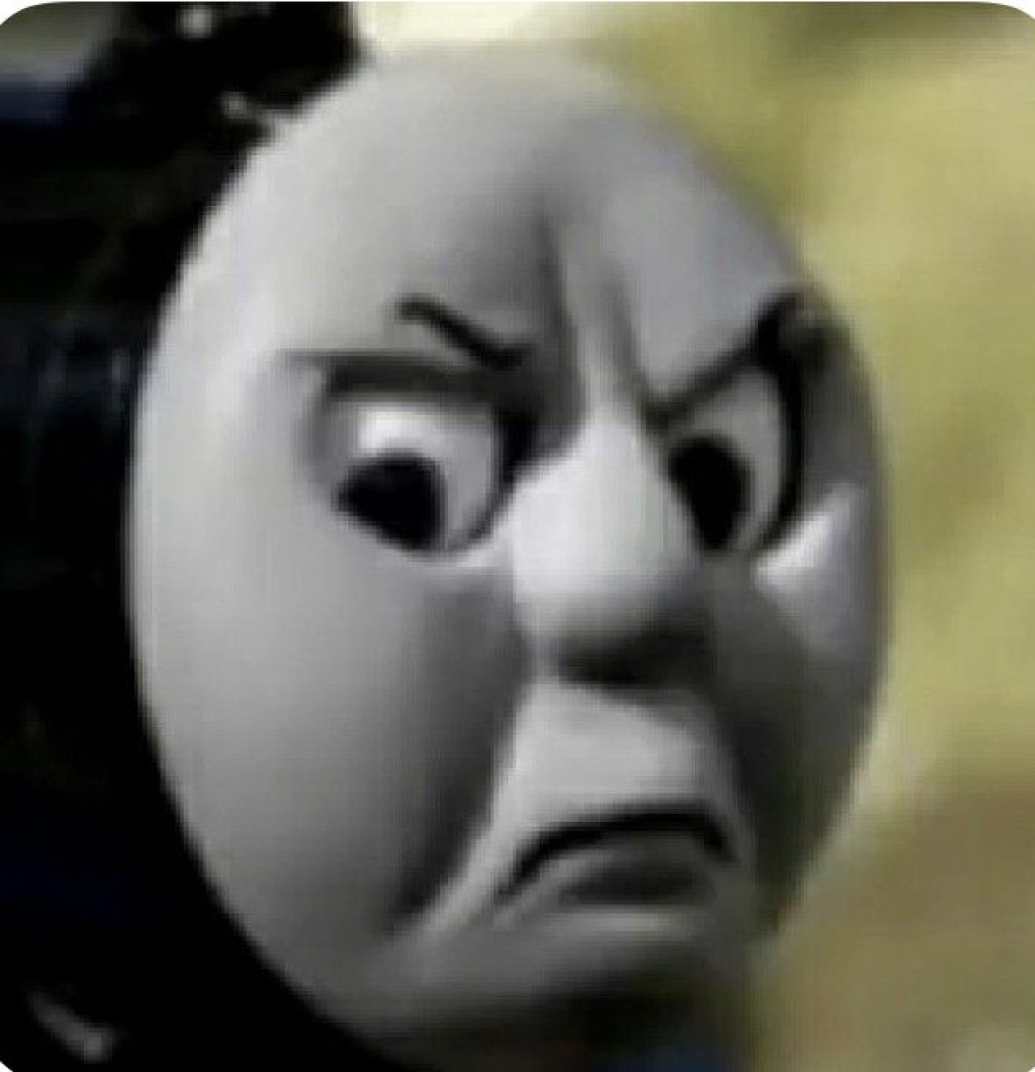Thomas the Tank Engine's face scrunched into a furious, scowling glare