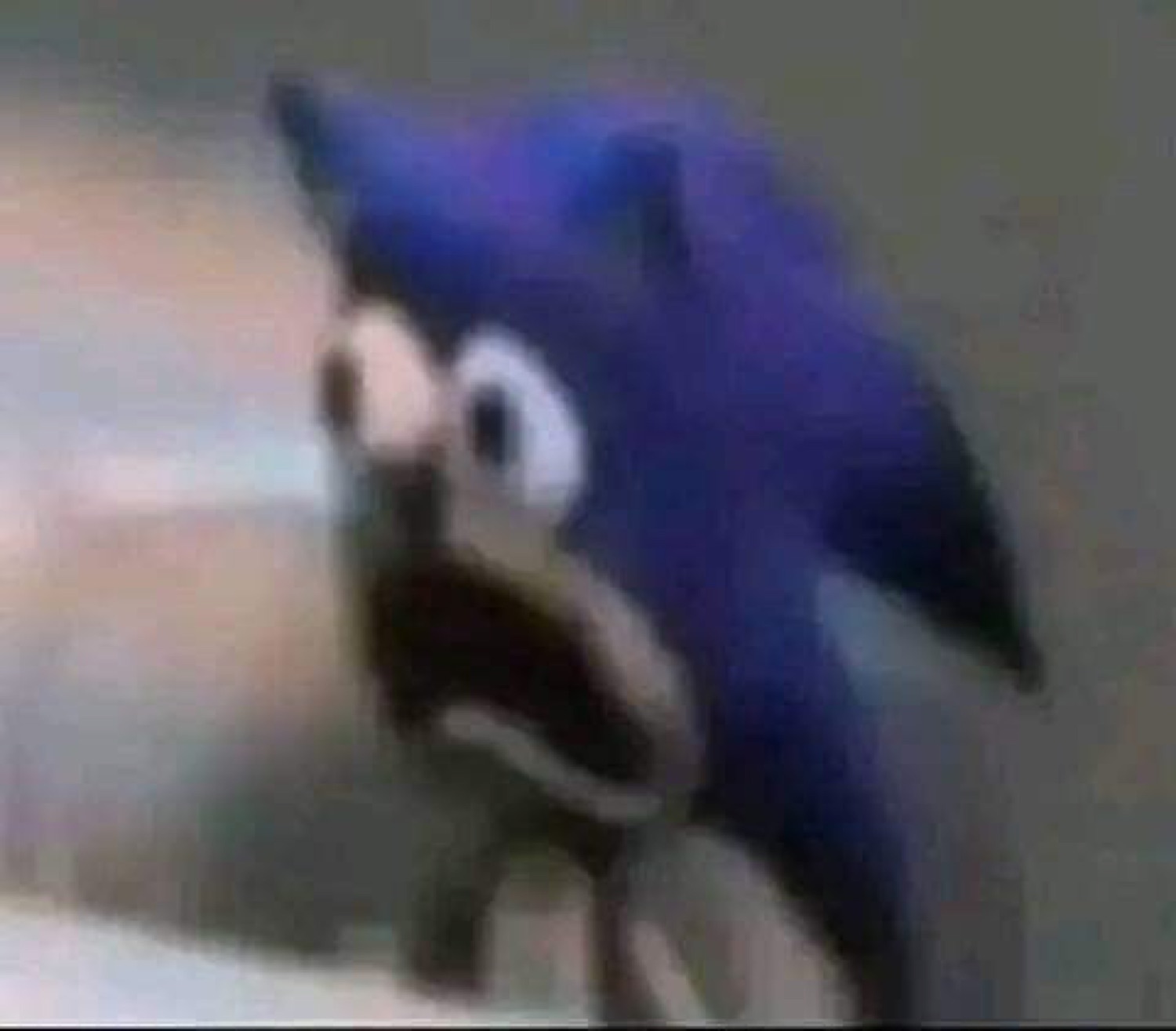 Sonic the Hedgehog plushie or figurine with a horrified wide-open mouth expression