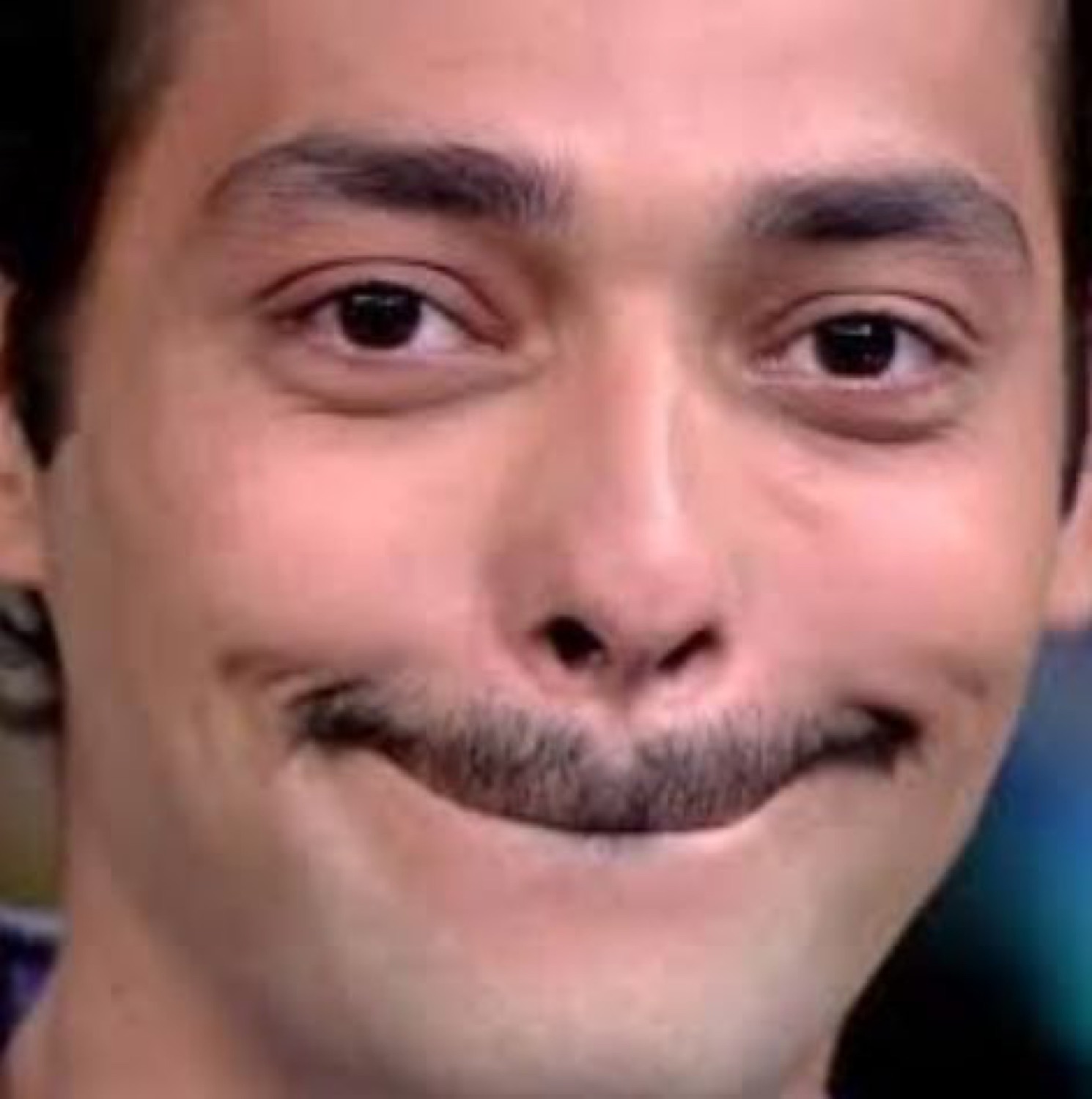 Guy with a smug half-smile and knowing look, completely unbothered and a little too pleased with himself