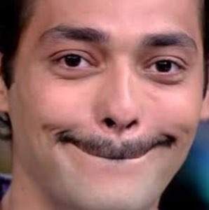 Guy with a smug half-smile and knowing look, completely unbothered and a little too pleased with himself