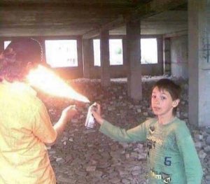 Kid casually flamethrowing another kid in an abandoned building with a can of spray paint