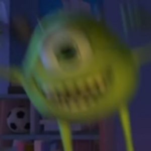 Blurry cursed close-up of a one-eyed green monster grinning wide