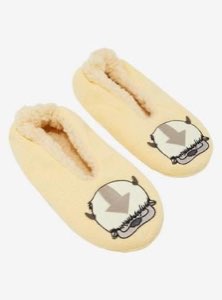 Pair of fuzzy yellow slippers featuring the Avatar sky bison Appa's arrow-marked face