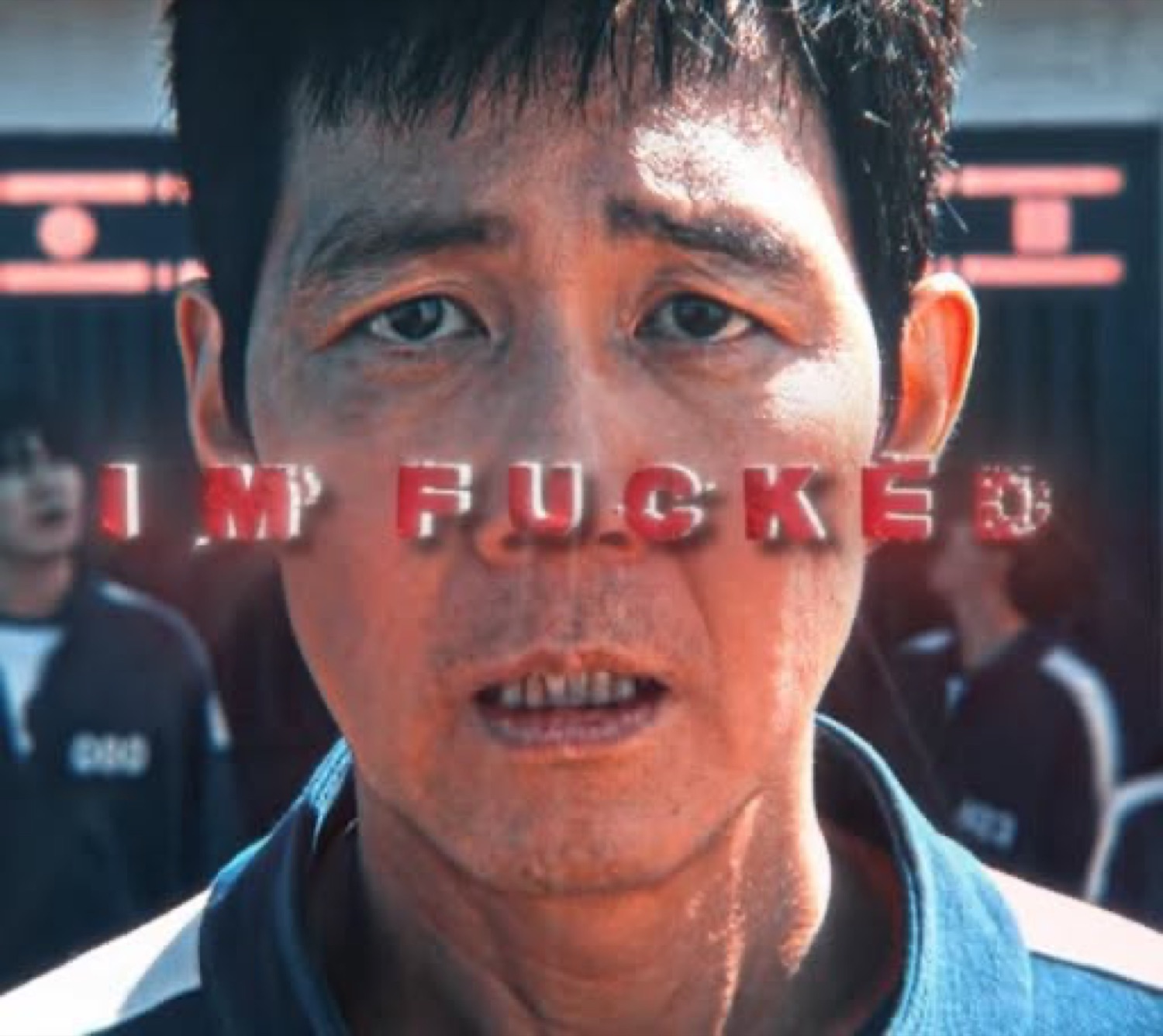 Squid Game player staring dead ahead in dread, captioned 'IM FUCKED'