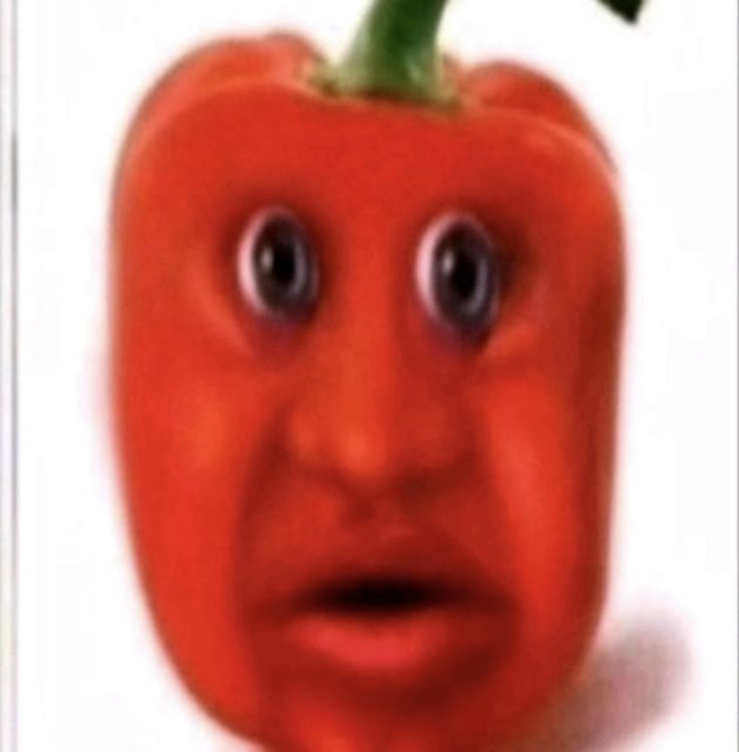 A red bell pepper with a photoshopped human face frozen in a wide-eyed, slack-jawed stare